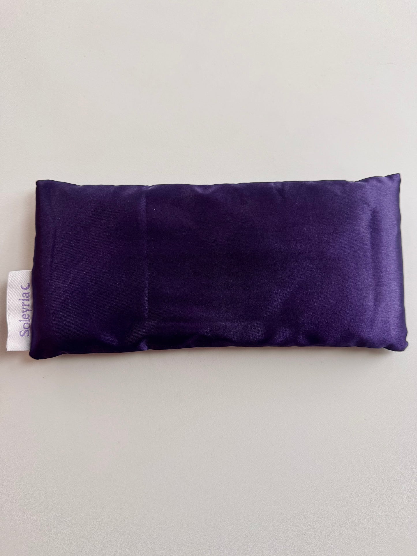 Soleyria purple satin lavender eye pillow for calming the nervous system.