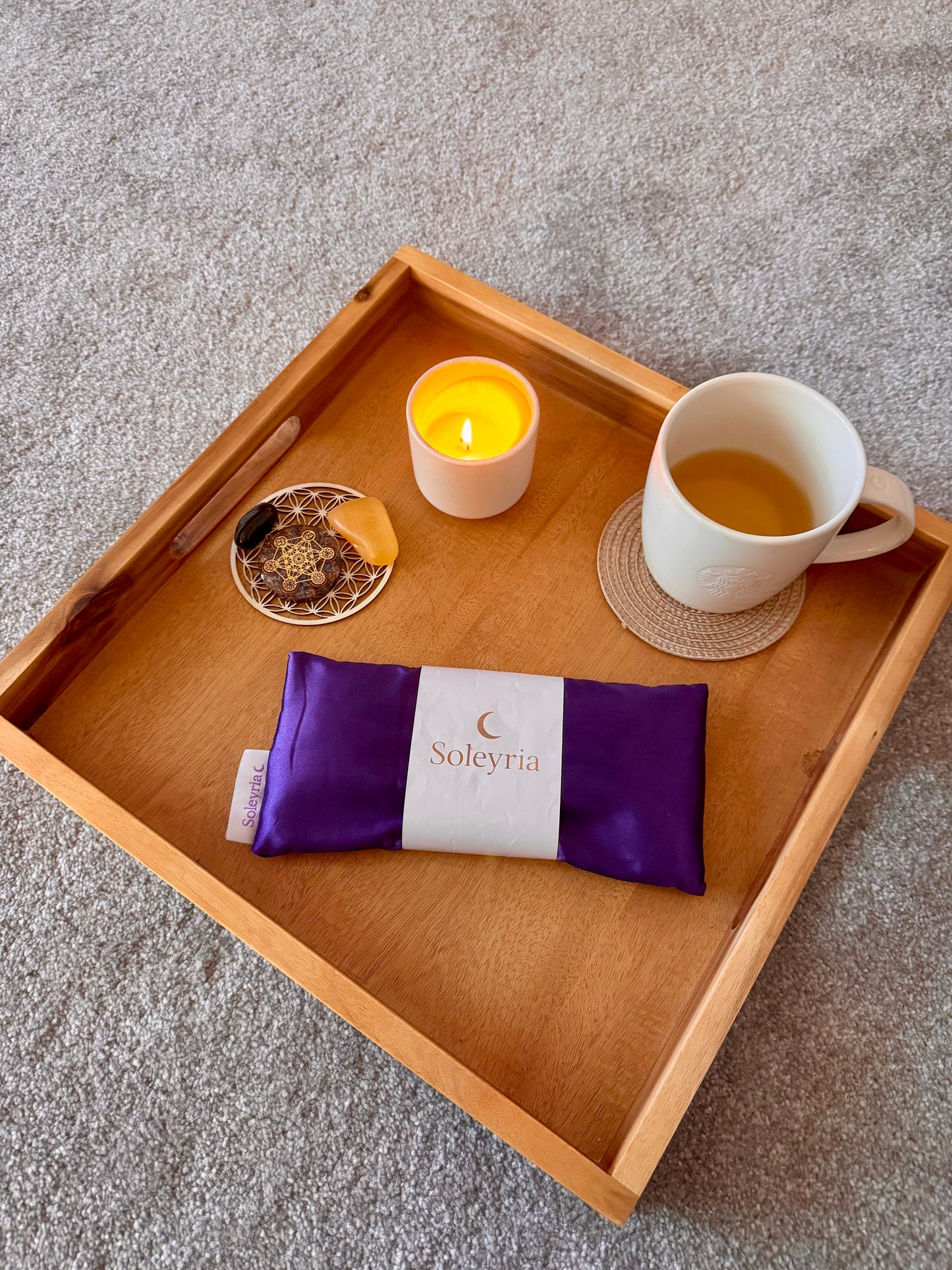 Evening ritual with Soleyria lavender eye pillow, candle, and tea.