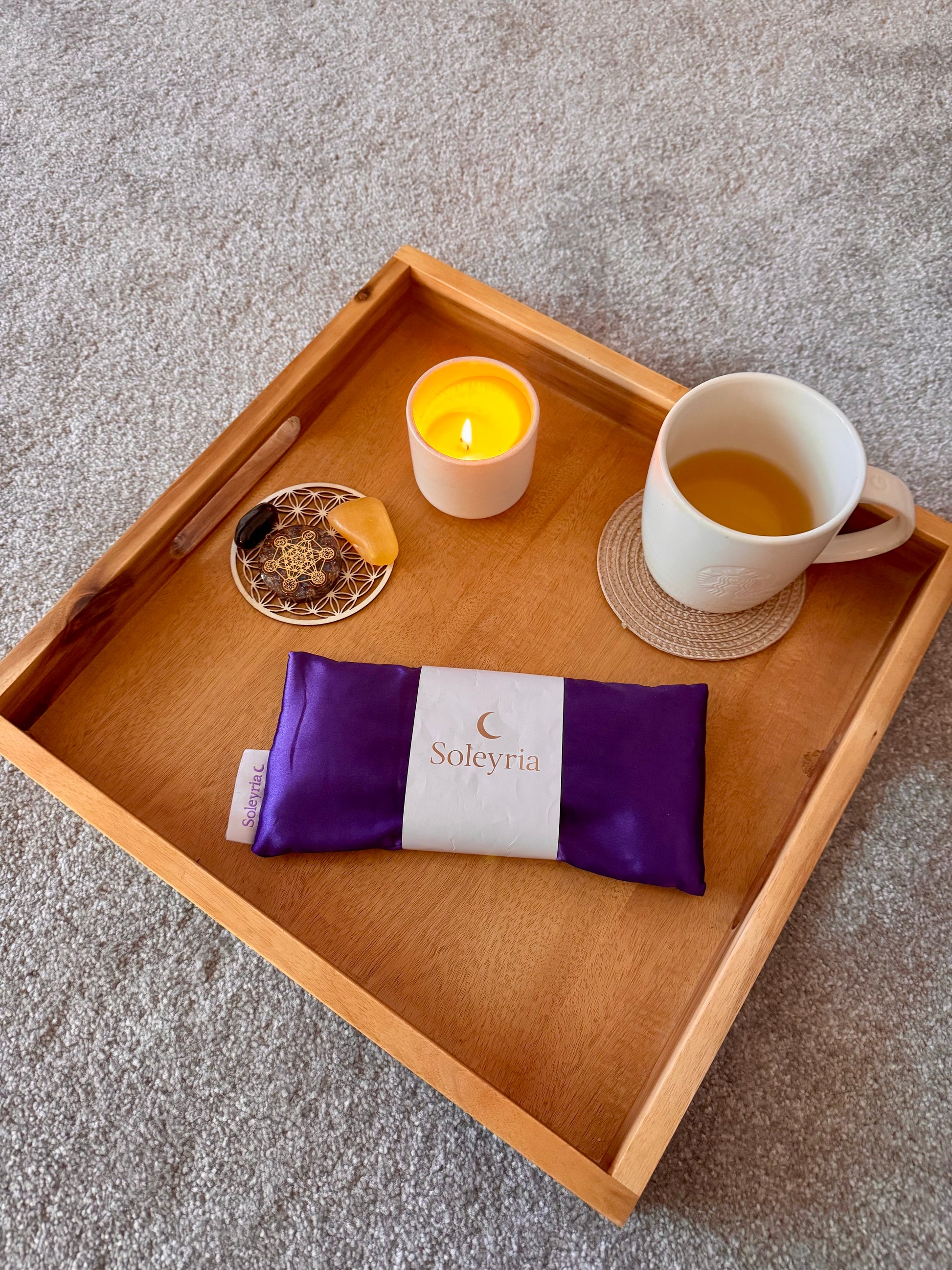 Evening ritual with Soleyria lavender eye pillow, candle, and tea.